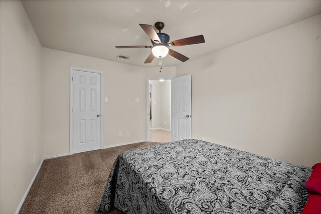 bedroom featuring carpet floors, a ceiling fan, baseboards, and visible vents