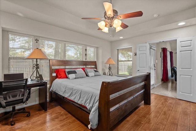bedroom featuring recessed lighting, baseboards, ceiling fan, and hardwood / wood-style floors