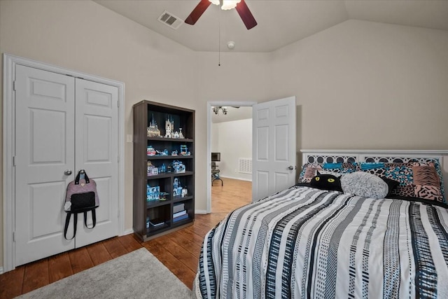 bedroom featuring ceiling fan, vaulted ceiling, wood finished floors, and visible vents