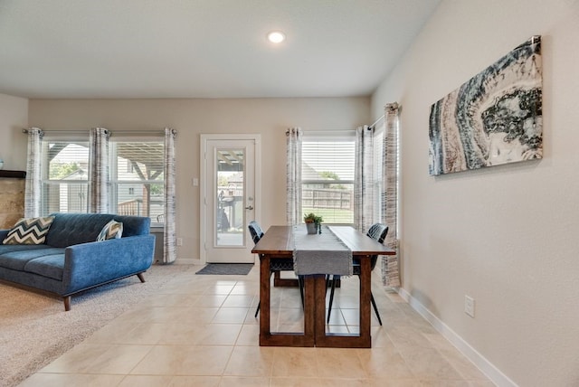 dining space with baseboards, a healthy amount of sunlight, light tile patterned flooring, and recessed lighting