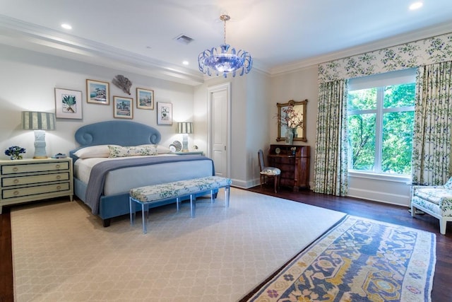 bedroom featuring wood finished floors, a chandelier, baseboards, ornamental molding, and visible vents