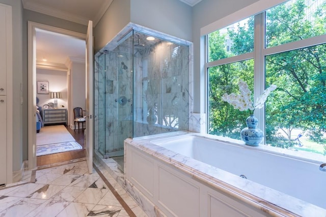 full bath with a shower stall, marble finish floor, ornamental molding, ensuite bath, and a garden tub