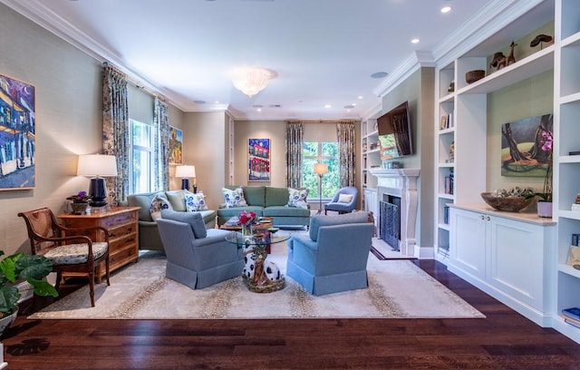 living room featuring recessed lighting, built in shelves, wood finished floors, a fireplace, and ornamental molding