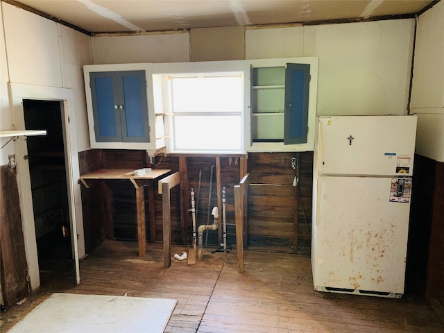 kitchen featuring freestanding refrigerator and hardwood / wood-style floors