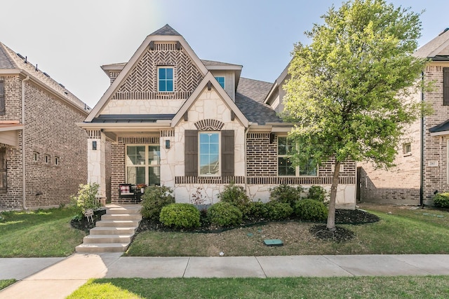 2061 Miramar Dr, Little Elm, TX 75068 - view of front of home with brick siding, a porch, stone siding, and a shingled roof