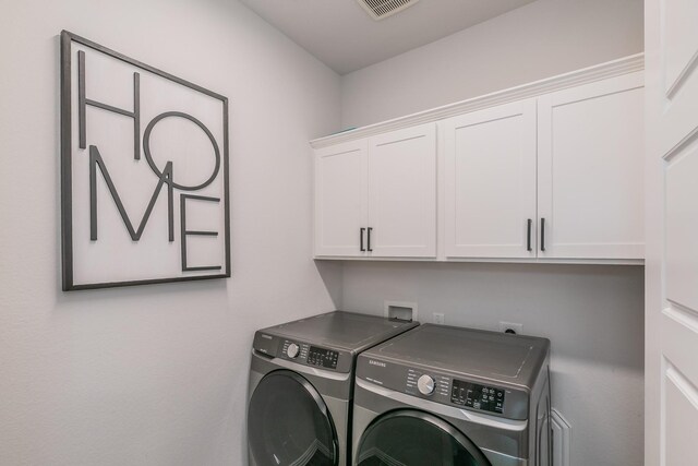 2061 Miramar Dr, Little Elm, TX 75068 - clothes washing area featuring cabinet space, independent washer and dryer, and visible vents