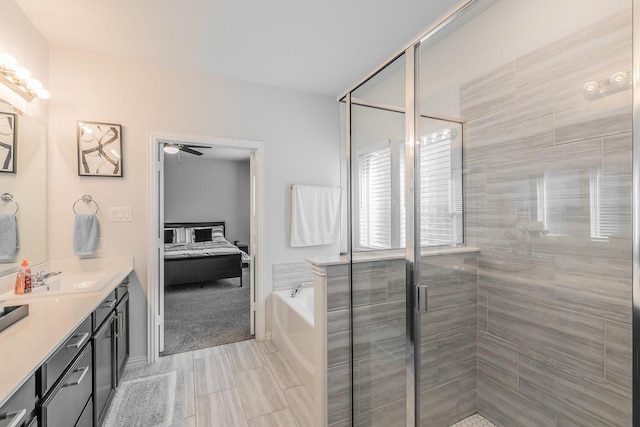2061 Miramar Dr, Little Elm, TX 75068 - bathroom with a shower stall, a garden tub, a ceiling fan, double vanity, and ensuite bath
