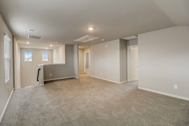 basement featuring visible vents, recessed lighting, and light colored carpet
