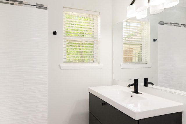 bathroom with a wealth of natural light and vanity