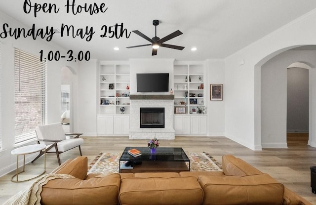 1503 Evening Primrose Dr, Mansfield, TX 76063 - living room featuring arched walkways, ceiling fan, wood finished floors, baseboards, and recessed lighting