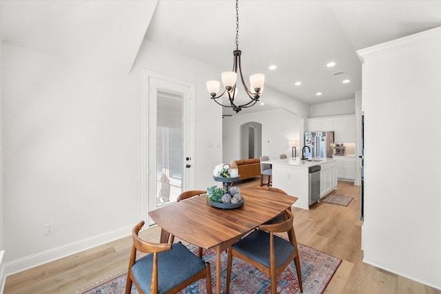 1503 Evening Primrose Dr, Mansfield, TX 76063 - dining area featuring arched walkways, light wood-type flooring, a chandelier, recessed lighting, and baseboards
