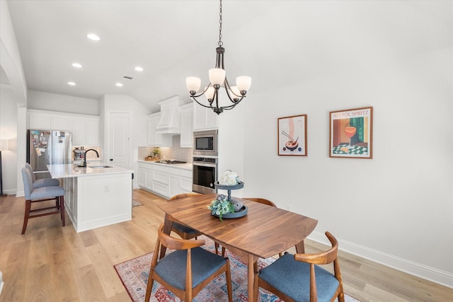 1503 Evening Primrose Dr, Mansfield, TX 76063 - dining space featuring a chandelier, light wood-style flooring, recessed lighting, baseboards, and vaulted ceiling