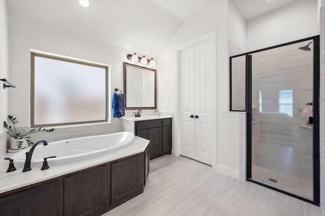 1503 Evening Primrose Dr, Mansfield, TX 76063 - full bathroom featuring a shower stall, a bath, vaulted ceiling, and vanity