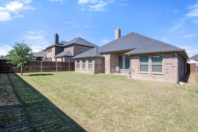 1503 Evening Primrose Dr, Mansfield, TX 76063 - rear view of property with roof with shingles, brick siding, and a chimney