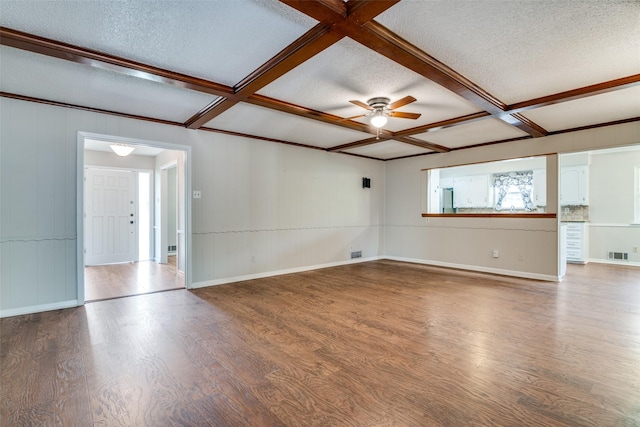 unfurnished room with wood finished floors, visible vents, a textured ceiling, and ceiling fan