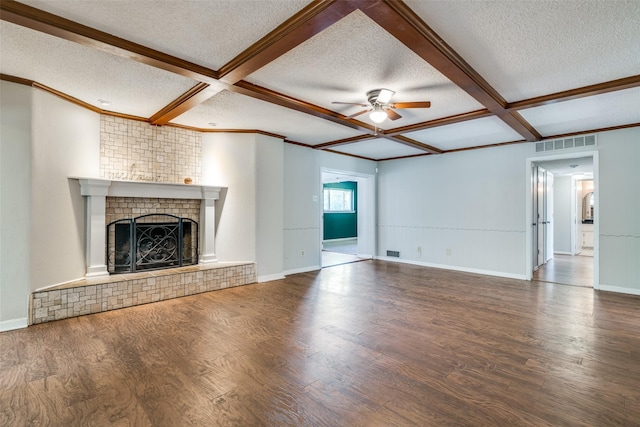 unfurnished living room featuring a textured ceiling, visible vents, coffered ceiling, a ceiling fan, and wood finished floors
