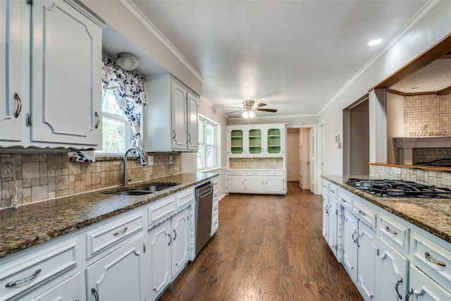 kitchen with black gas cooktop, backsplash, dishwasher, a sink, and dark wood-type flooring