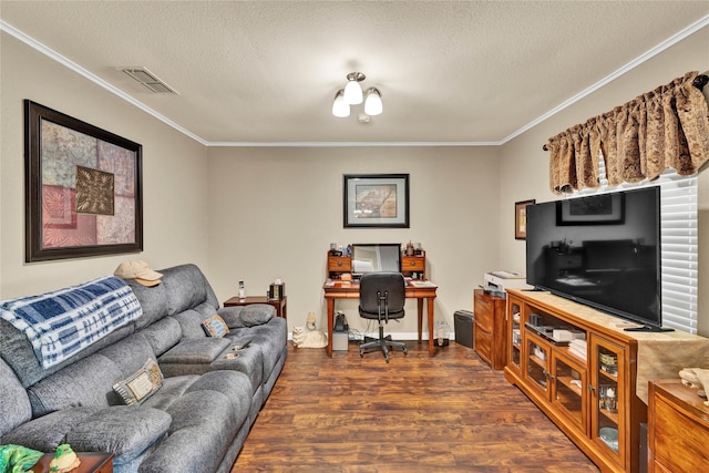 living area with visible vents, wood finished floors, a textured ceiling, and ornamental molding