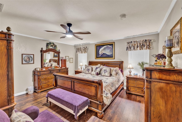 bedroom with dark wood finished floors, baseboards, ornamental molding, and visible vents