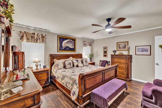 bedroom with baseboards, dark wood-style floors, ornamental molding, and ceiling fan