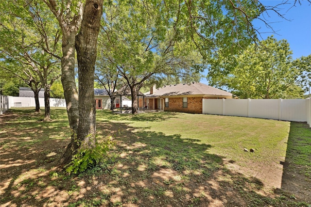 view of yard featuring a fenced backyard