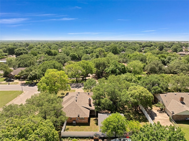 drone / aerial view featuring a view of trees