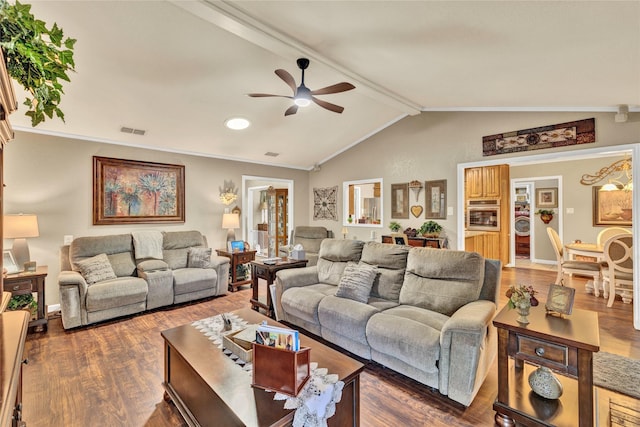 living area featuring wood finished floors, visible vents, a ceiling fan, and vaulted ceiling with beams