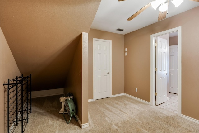 additional living space featuring carpet floors, visible vents, baseboards, and ceiling fan