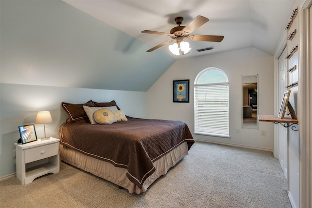 bedroom featuring lofted ceiling, carpet flooring, baseboards, and a ceiling fan