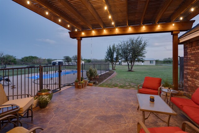 view of patio featuring fence, a fenced in pool, and a pergola