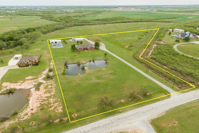 aerial view with a rural view and a water view