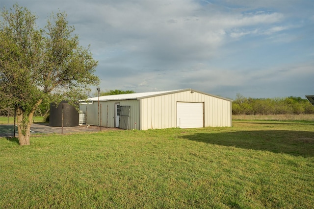 view of pole building with a yard