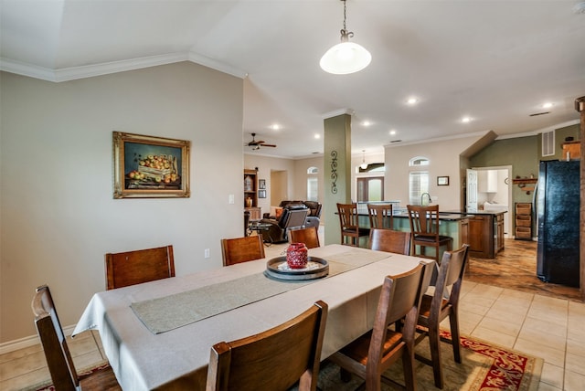 dining space with a ceiling fan, light tile patterned flooring, lofted ceiling, ornamental molding, and recessed lighting