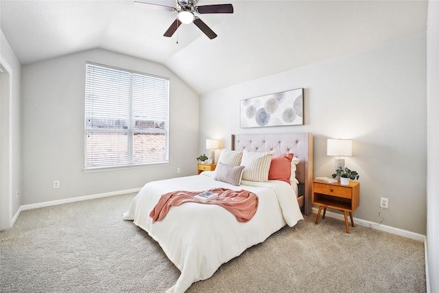 bedroom with lofted ceiling, carpet flooring, baseboards, and a ceiling fan
