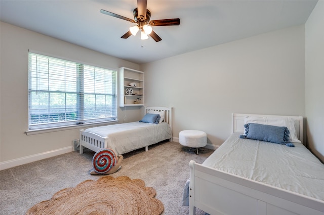 bedroom with baseboards, carpet, and ceiling fan