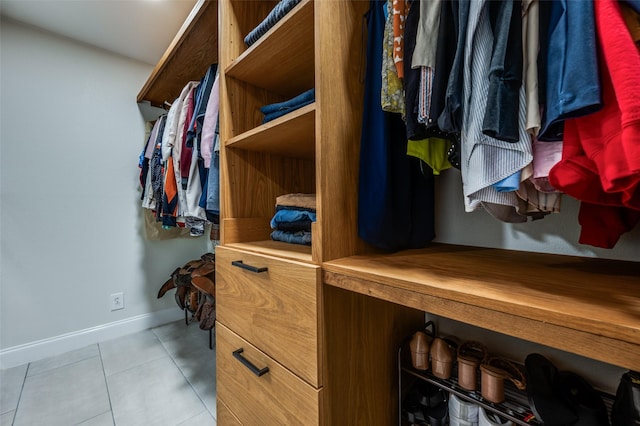 walk in closet featuring light tile patterned floors