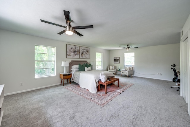 carpeted bedroom with baseboards and ceiling fan