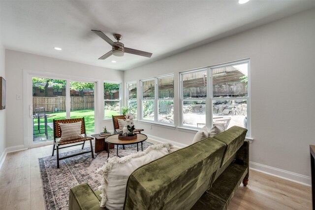 living room with a ceiling fan, light wood-type flooring, baseboards, and recessed lighting