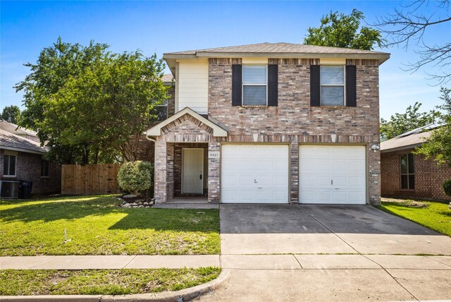traditional-style home featuring an attached garage, central AC unit, brick siding, and concrete driveway