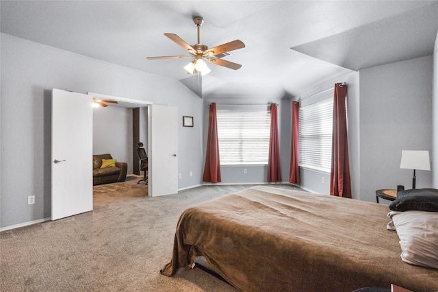 bedroom featuring ceiling fan, carpet flooring, and lofted ceiling