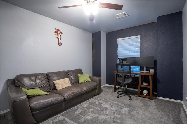 carpeted office space featuring a ceiling fan, baseboards, and visible vents
