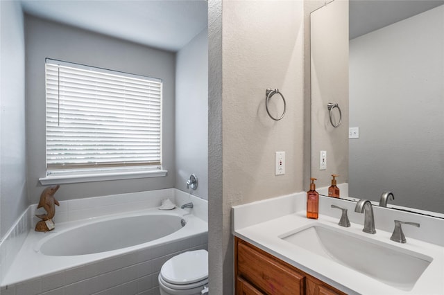 full bath with toilet, a garden tub, and vanity