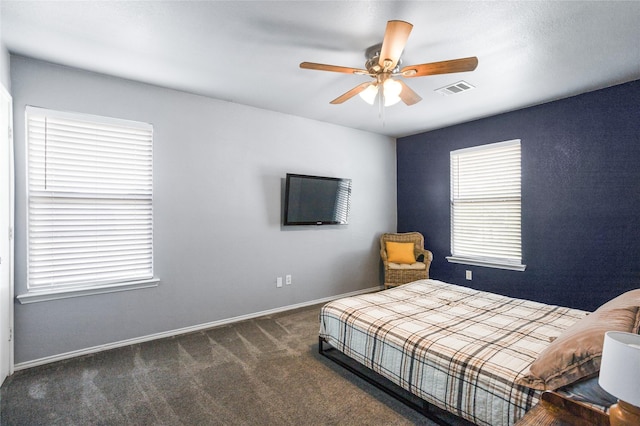 bedroom with carpet floors, baseboards, visible vents, and ceiling fan