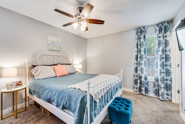 bedroom with baseboards, a ceiling fan, and carpet flooring