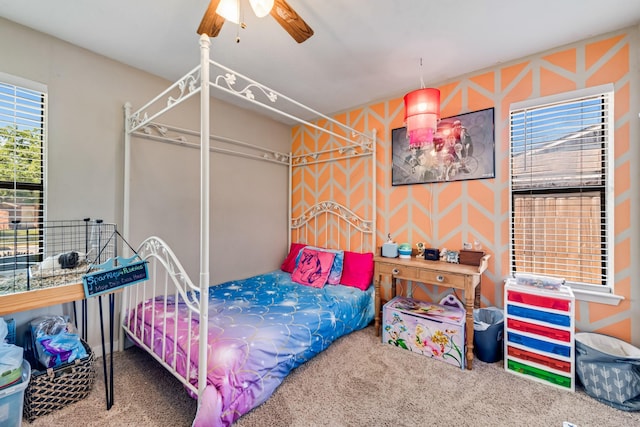 carpeted bedroom featuring a ceiling fan
