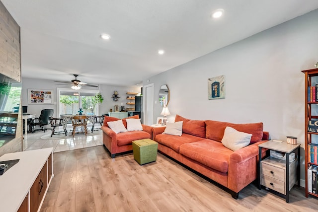 living room with recessed lighting, light wood-style flooring, and ceiling fan