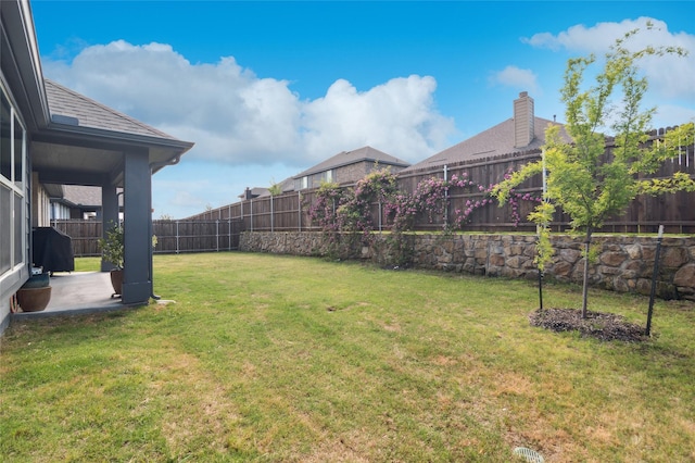 view of yard with a fenced backyard and a patio