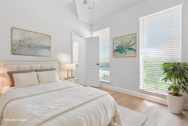 bedroom featuring baseboards and light wood-style floors