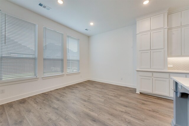 4600 Paintbrush Way, Aubrey, TX 76227 - unfurnished dining area featuring recessed lighting, visible vents, light wood finished floors, and baseboards