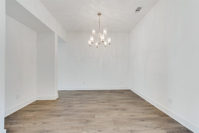 4600 Paintbrush Way, Aubrey, TX 76227 - unfurnished dining area featuring an inviting chandelier, wood finished floors, visible vents, and baseboards